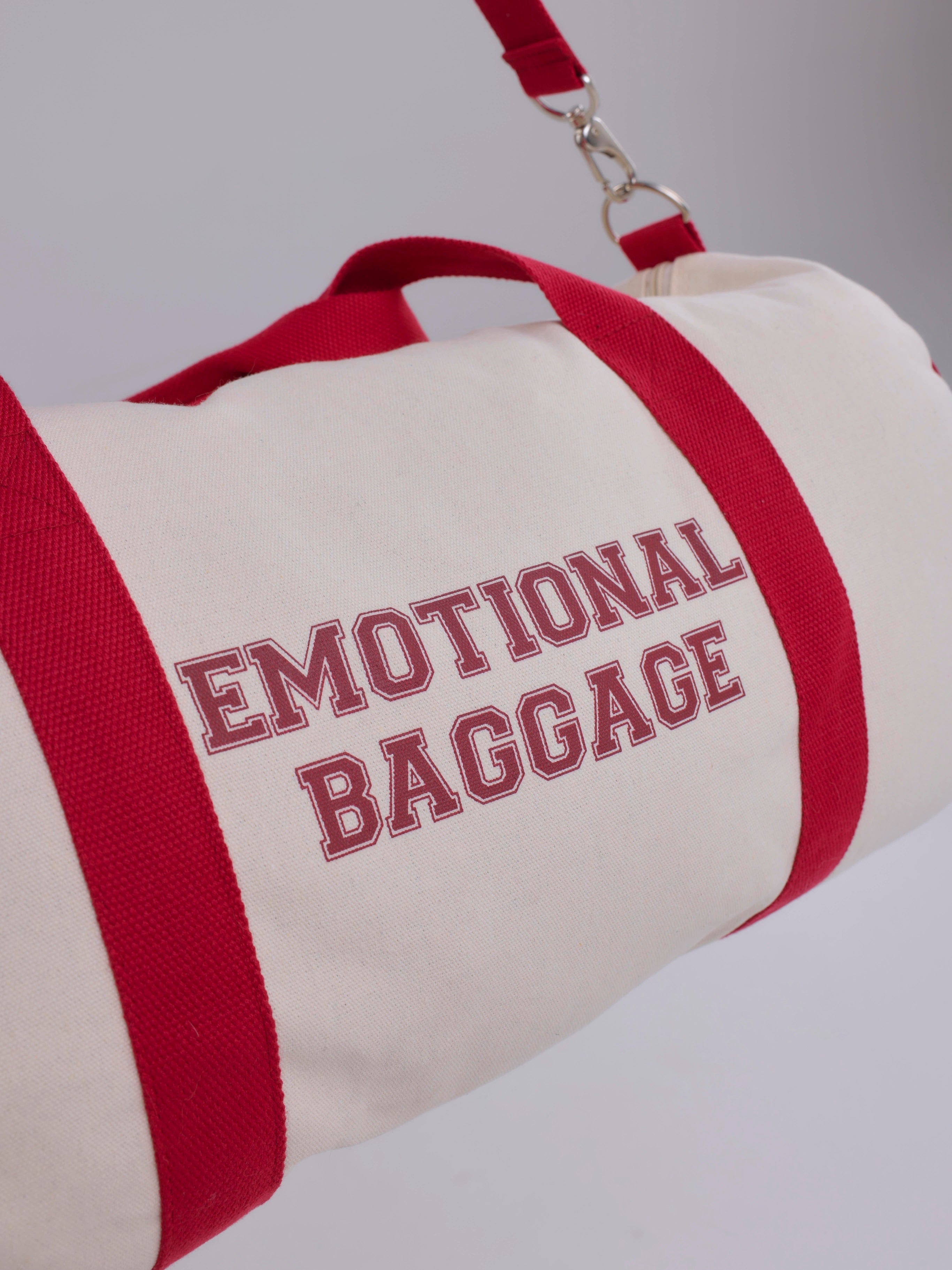 Bag with 'EMOTIONAL BAGGAGE' text on a plain background
